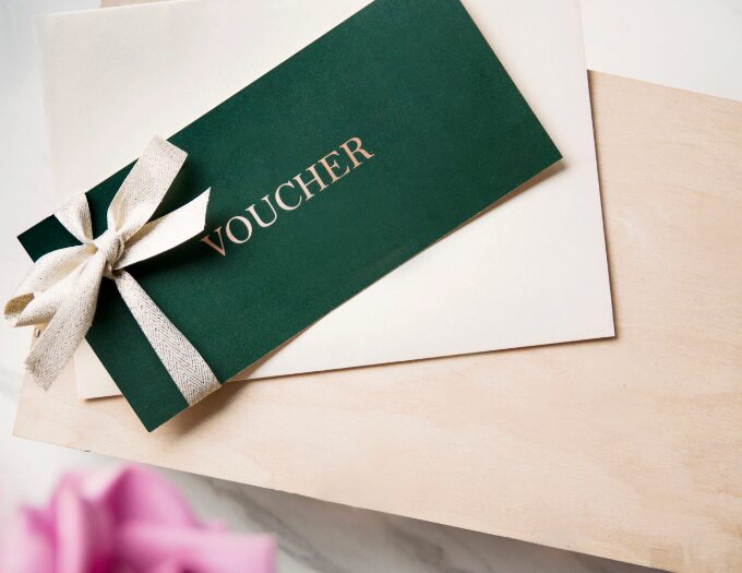 green and white envelope of voucher
