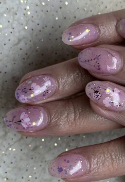 Picture of nail art hand with pink flowers