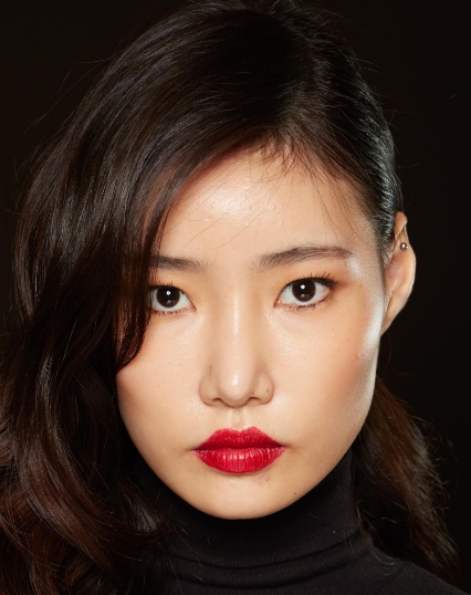Picture of a lady with dewy makeup and classic red lip