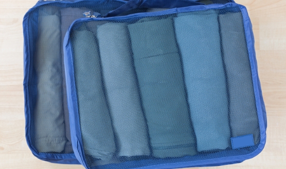 Picture of five blue shirts rolled up