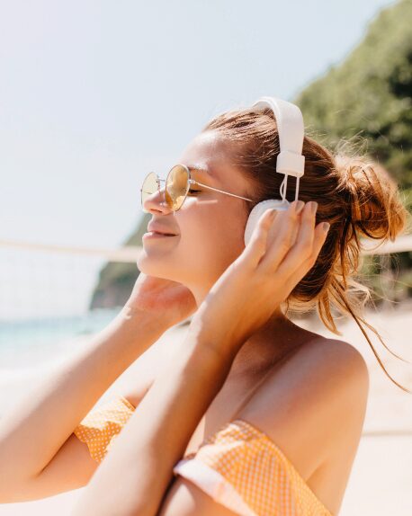 Picture of a young person listening to music in headphones